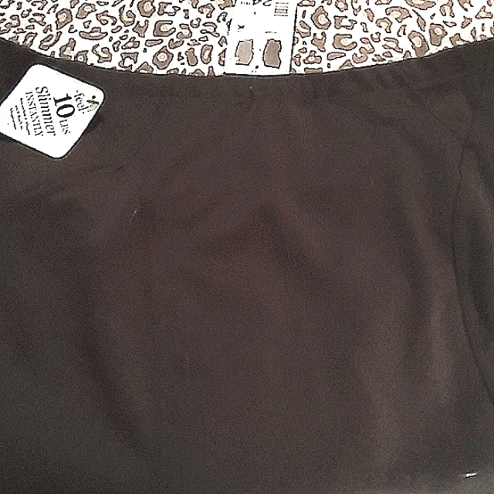 Slimming black pencil skirt with build in shape wear Technology. NWT
